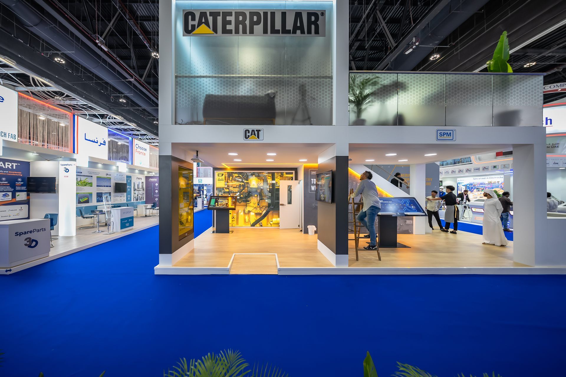 Caterpillar 50 + 40 sqm exhibition stand at ADIPEC by Messe.ae