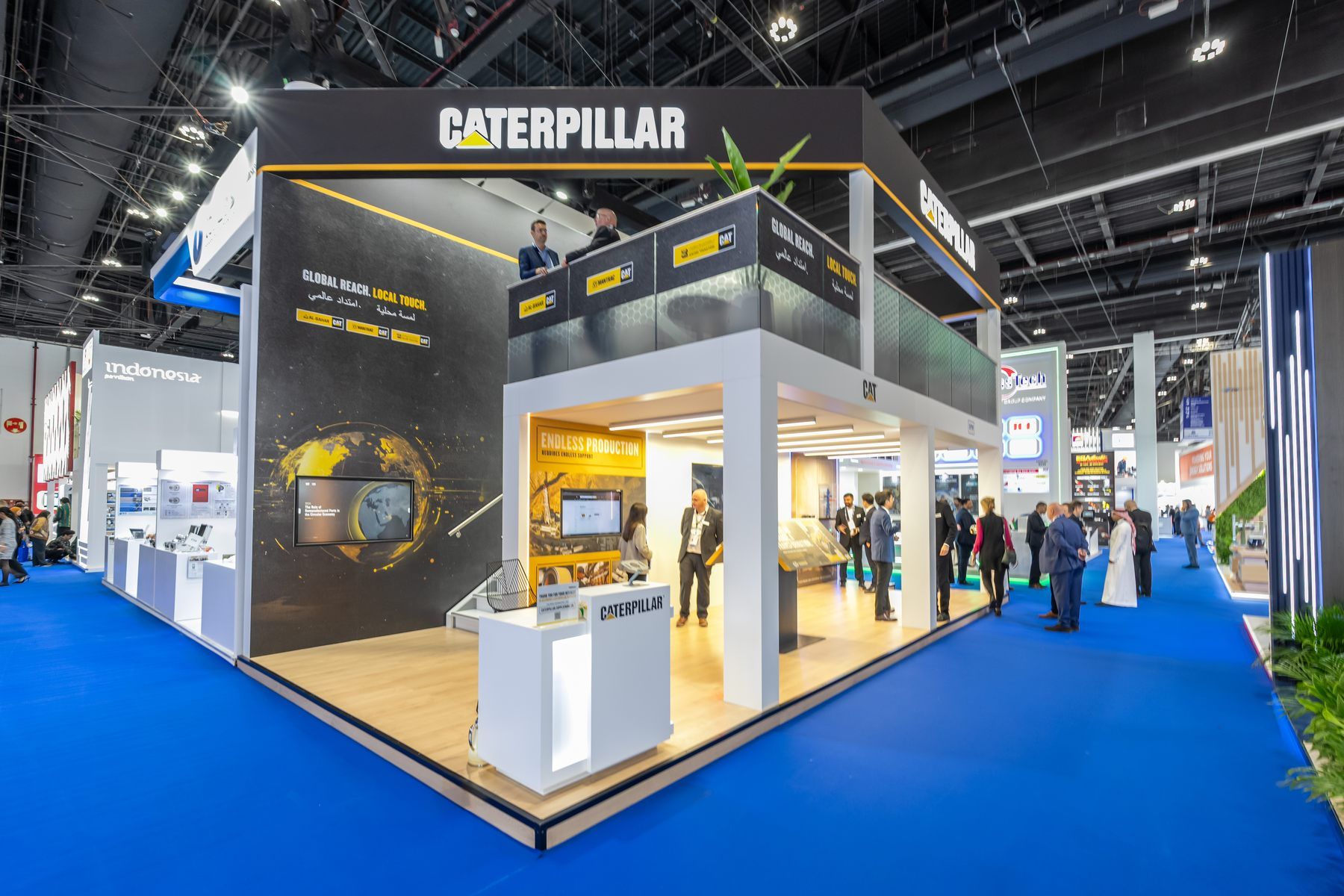 Caterpillar 50 + 40 sqm exhibition stand at ADIPEC by Messe.ae